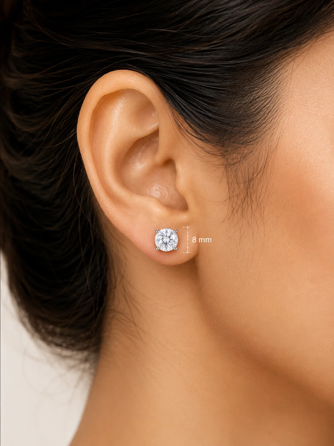 Close-up of a Celeste Petite American Diamond solitaire stud on an ear showing its 8 mm diameter