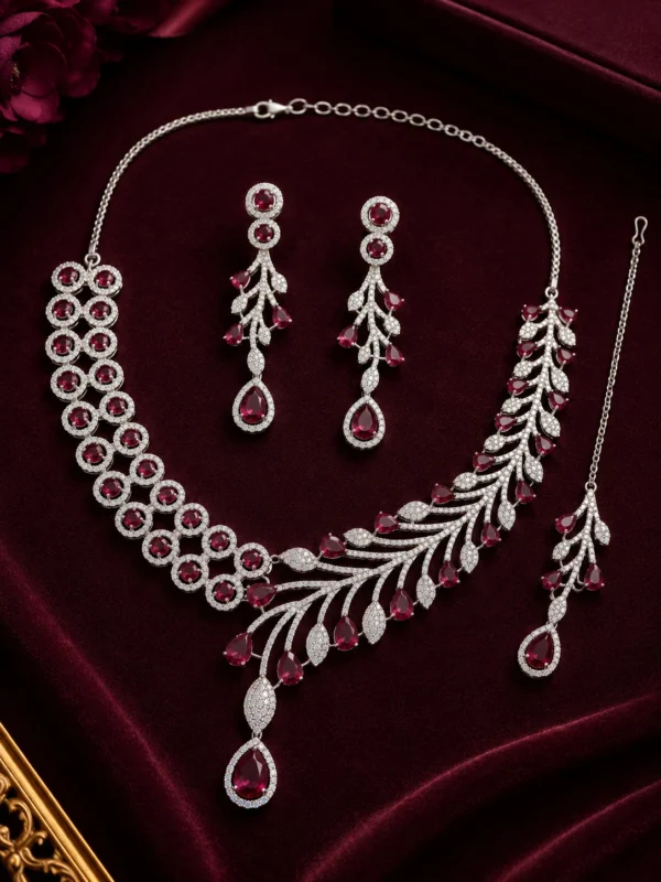 Rhodium-plated Crimson Royale AD jewellery set displayed with necklace, earrings and maang tikka